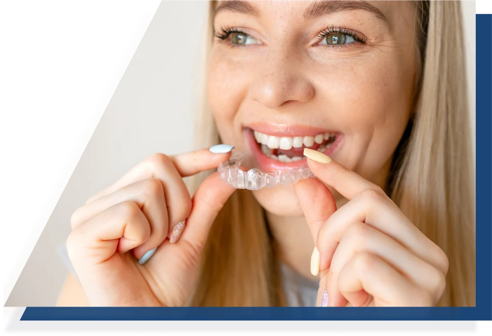 A woman putting on Invisalign